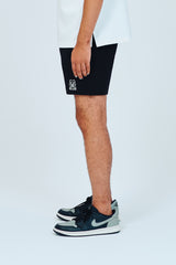 EMBLEM DRY STRETCH SHORT PANTS - BLACK
