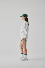 BINDING TRACK SHORTS - WHITE (MODEL SIDE)
