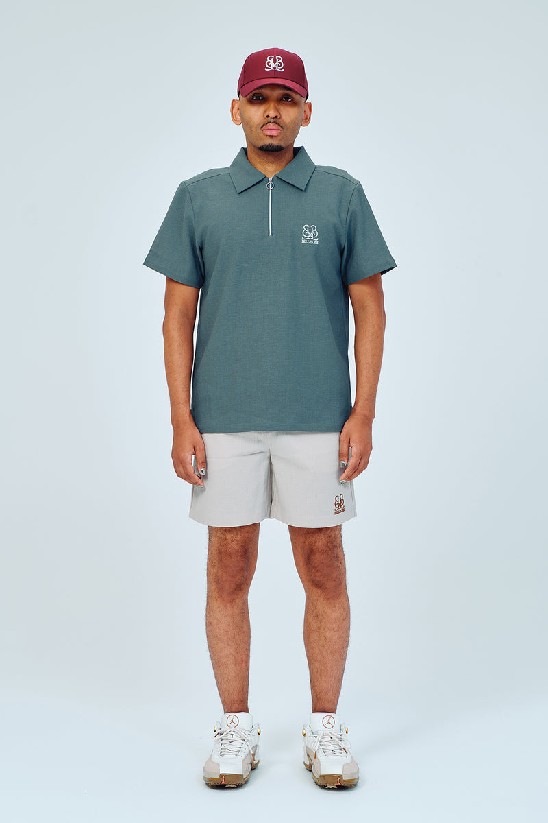 EMBLEM DRY STRETCH SS ZIP POLO SHIRT - BLUE